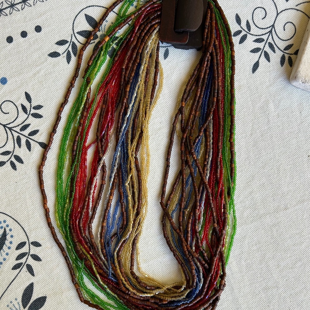 Multi strand beaded necklace in wood and coloured glass beads